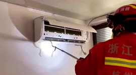 Firefighters remove snake from air conditioner in China