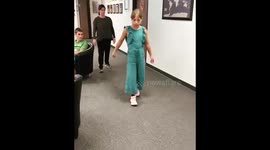 Girl learns to walk with prosthetic legs after losing limbs in Ukraine train station attack