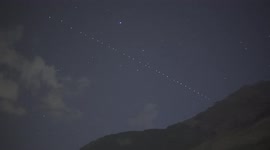 Train of Starlink satellites light up night sky in Swiss Alps