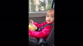 Baby girl wiggles in sync with rapper Lil Wayne