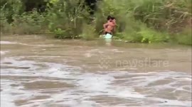 Hero resident saves two schoolchildren swept away by raging floods in Thailand