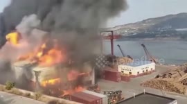 Fire breaks out at wharf in China 'after piles of timber catch fire' in storage area