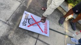Protesters stamp on PM's picture amid angry rally in Bangkok, Thailand