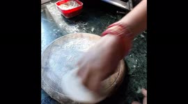 Indian village cooking . Odisha Village women making Roti in home. village rural life of sambalpur .
