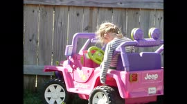 Girl Sleeps in Toy Jeep