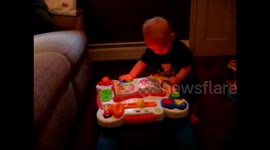 Boy Plays With Musical Table