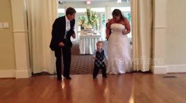 Boy Dances With Wedding Couple
