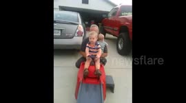 Boy Rides Toy Car