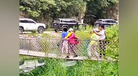 Woman repeatedly shakes bridge rail for videos in China