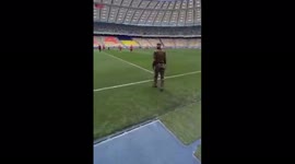 Ukrainian soldier kicks off to mark return of country's football league