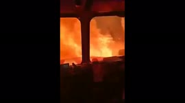 Russian firefighters drive head-on through blaze as wildfire burns forest