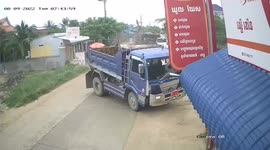 Truck topples over after clipping oncoming vehicle in Cambodia