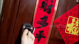 Woman uses toe to unlock fingerprint lock on door