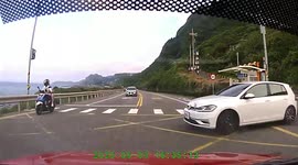 Close call: Car pulls out from a junction to try merge into lane and cuts off oncoming driver (Dashcam Video)