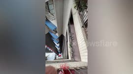 Chinese woman uses rope to hoist takeaways up to 24th floor as lift stops working