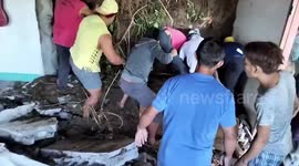 Rescuers battle to pull children trapped under rubble after powerful quake in the Philippines