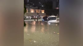 Bus wades through heavy flood during tropical storm in Philippines