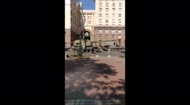 Kyiv locals pose for pictures with destroyed Russian tanks on Ukraine's independence day