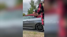 Shocking moment drone pilot threatened by man brandishing a gun
