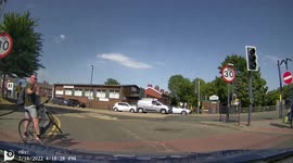 Cyclist nearly gets run over at top of motorway slip road through not looking