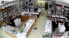 Optician employees shocked as colleague falls through ceiling in China