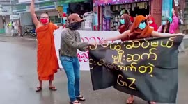 Masked monks march in city streets to protest dictatorship in Myanmar