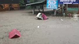 Floods swamp homes as rainwater surges from mountains in northern Thailand