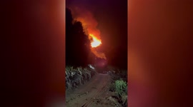 Firefighters hose down wildfires tearing through woodlands in southwest China