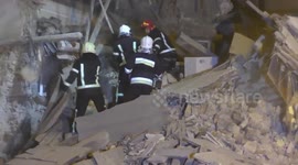 Emergency services search for survivors after missile destroys building in Lviv