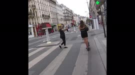 Refusal of priority by a shareable electric scooter (by Dott) on a zebra crossing despite the pedestrian's stop gesture. Paris, rue de Rivoli, France. 26 aug 2022.