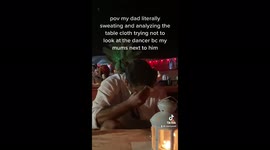 Dad tries his hardest not to look at dancer to avoid wife's anger