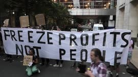 Protesters OFGEM HQ Canary Wharf block the road with their banner causing traffic.