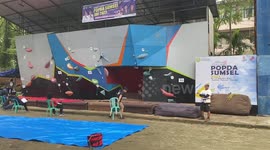 Wall-climbing athletes who are competing In Palembang