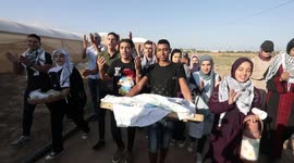 Palestinian youth take part in a cultural event near the border with Israel