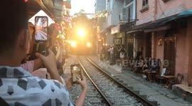 Train street cafe in Hanoi is most dangerous place when you can drink coffee while touching hullof train