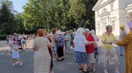 Old people and children are dancing tango in Central Park of St Petersburg, Russia