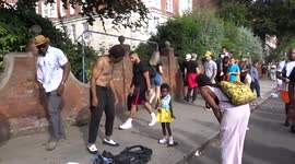 Baby girl draws crowds as she joins Caribbean tap dancer on the way to Notting Hill Carnival 2022
