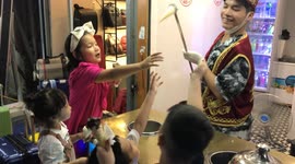 A young man selling ice cream teases and tricks super funny kids in Vietnam