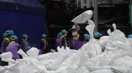 Soldiers lay sandbags amid flood fears in Bangkok, Thailand