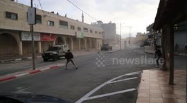 Palestinians inspect the house after a Israeli raid in the northern West Bank town of Qabatya.