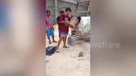 Resourceful construction workers use cement mixer as makeshift washing machine