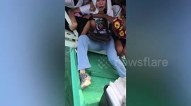 Tourists plunge into sea when their boat capsized while taking selfies