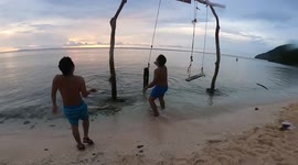 Tourist thrown into water as beach swing snaps while taking selfie