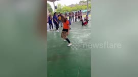 Contestants battle to put on shorts without using their hands during hilarious game in Thailand