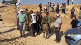 Israeli forces prevent the education staff and teachers from reaching the Jinba school, which is threatened with demolition in Masafer Yatta, in the West Bank city of Hebron, on the first day of school after the summer holiday