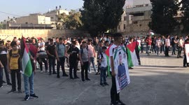 Classmates of Palestinian Hussein Taha, who was killed by Israeli forces mourn his death on the first day of school after the summer holiday, in the West Bank city of Nablus