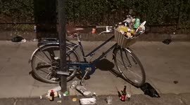 A Bike basket is filled with rubbish by people attending the Notting Hill Carnival
