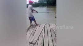 Rescuers search for boy, 10, eaten alive by croc while playing in river in the Philippines