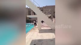 Protesters storm Baghdad's Republican Palace and leap into pool