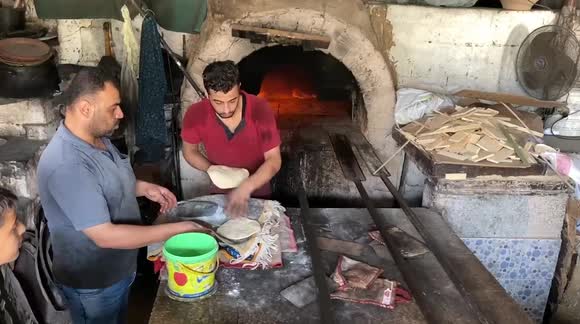 Electricity cuts bring the people of the Gaza Strip back to using the old clay kilns.